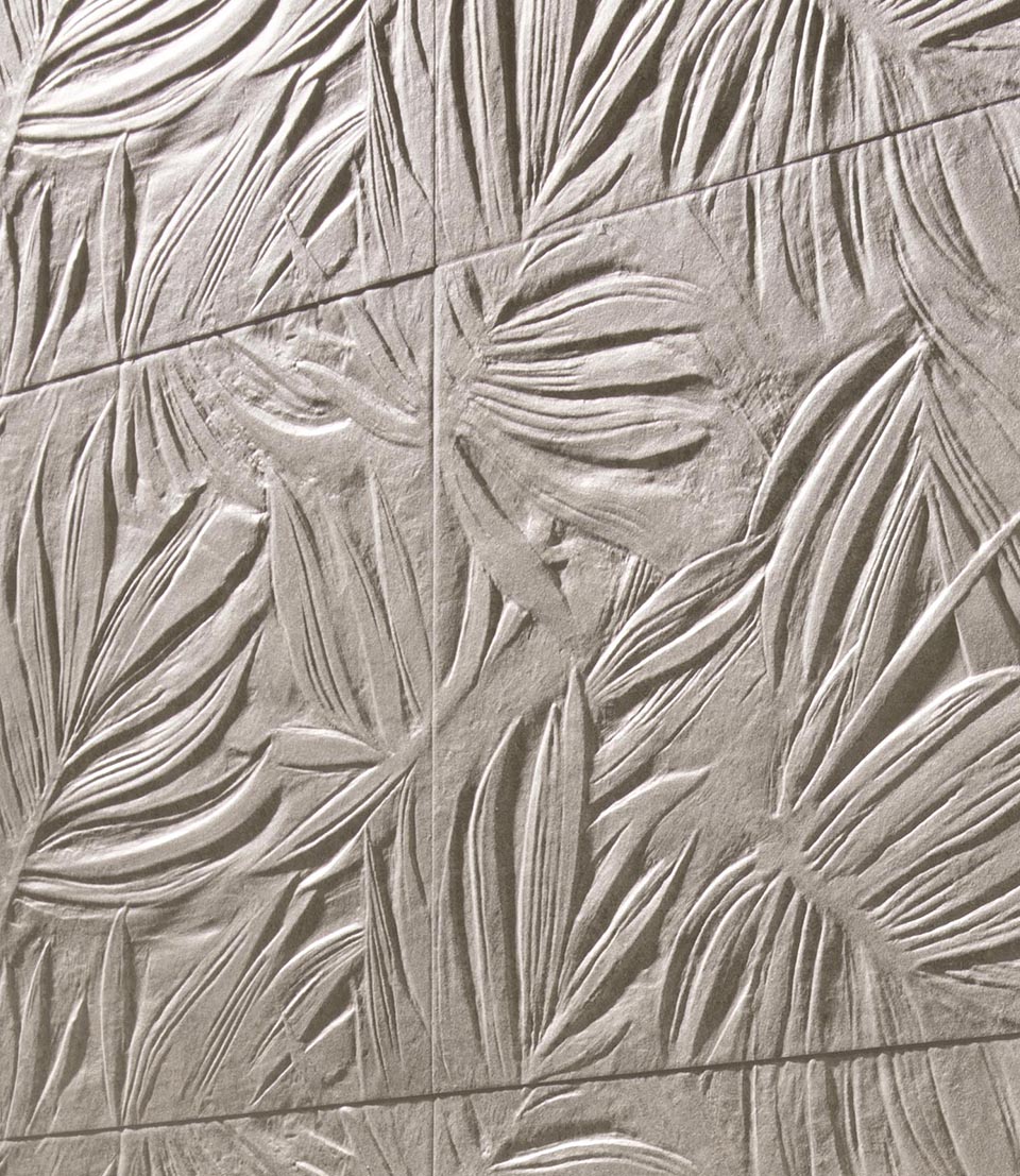 Detail of stoneware stone effect 3d decoration with sculpted leaf motif, matt finish.
