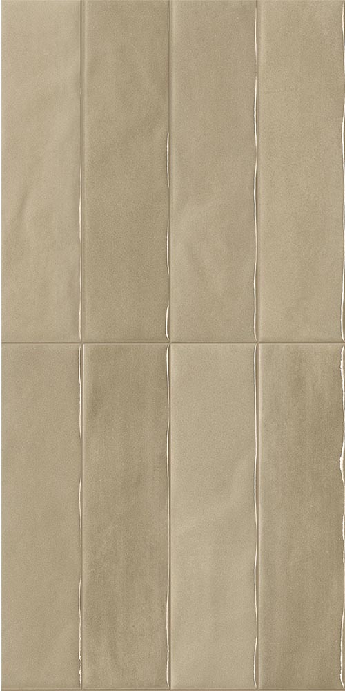 Glossy glazed ceramic tile in taupe shade, blurred and reflective surface, vertical rectangular format.