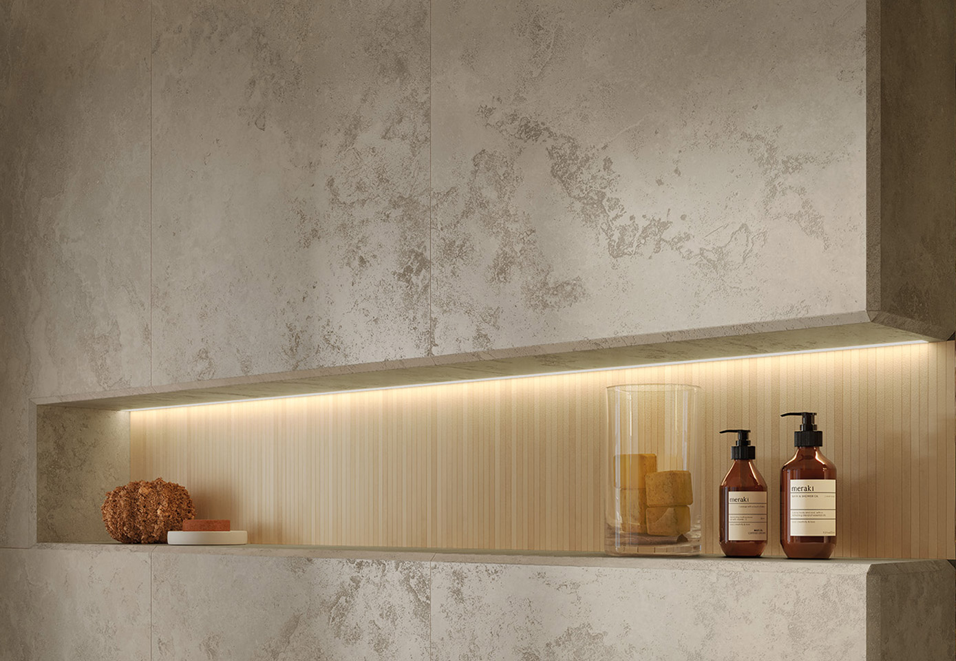 Backlit niche with light wood effect cladding and beige stone effect porcelain stoneware walls, bathroom products