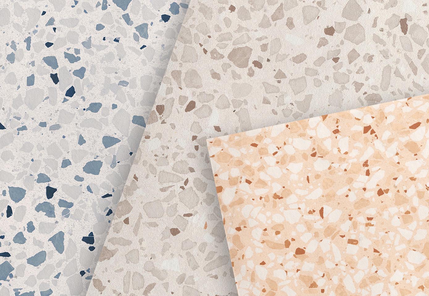 Terrazzo effect tiles in pastel tones with exposed grits, in three variations: blue, light gray and light peach.