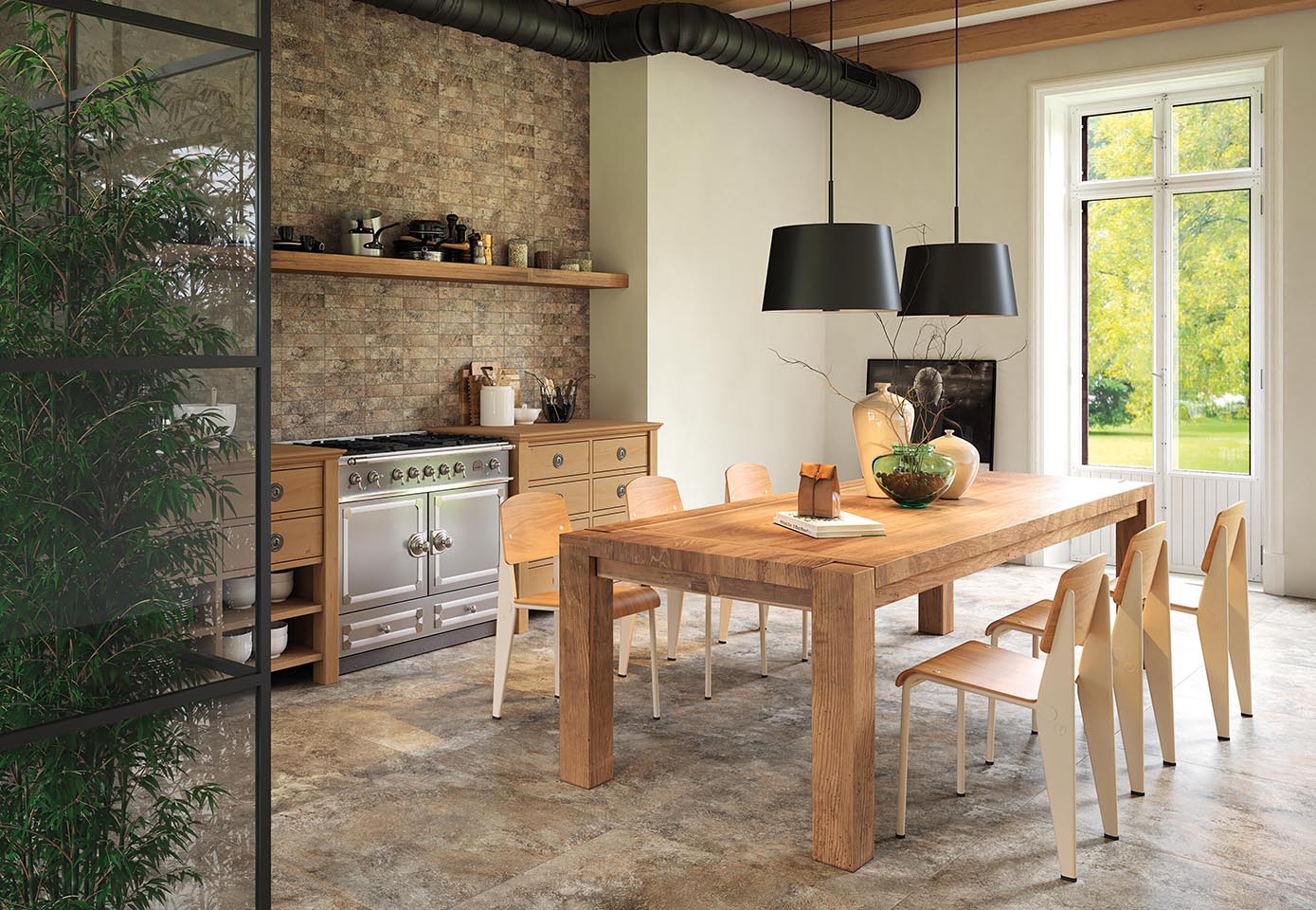 Rustic-modern kitchen with stone-effect flooring, brick wall and natural wood and metal furniture.