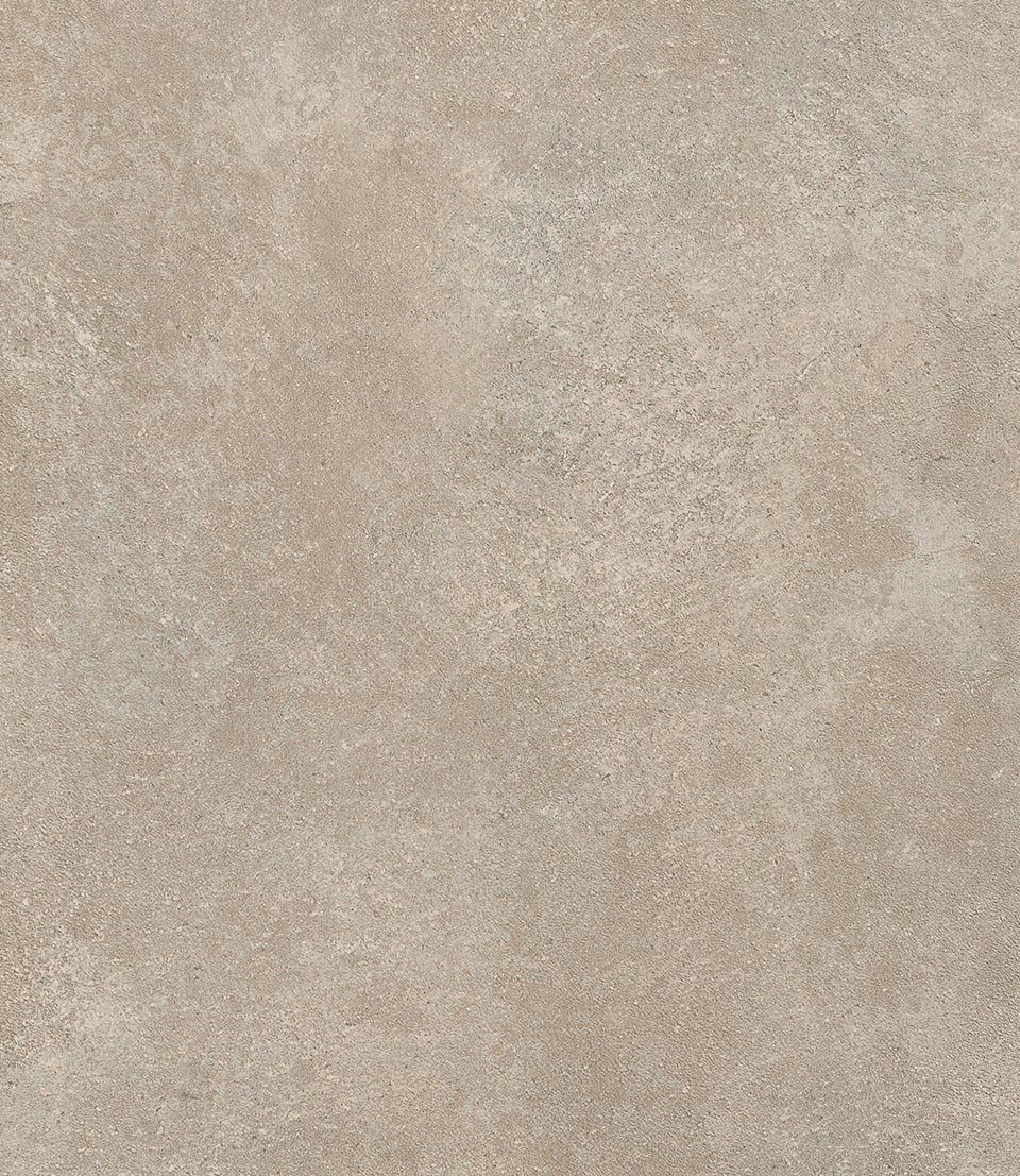 Textured surface of sand-coloured stone effect tile