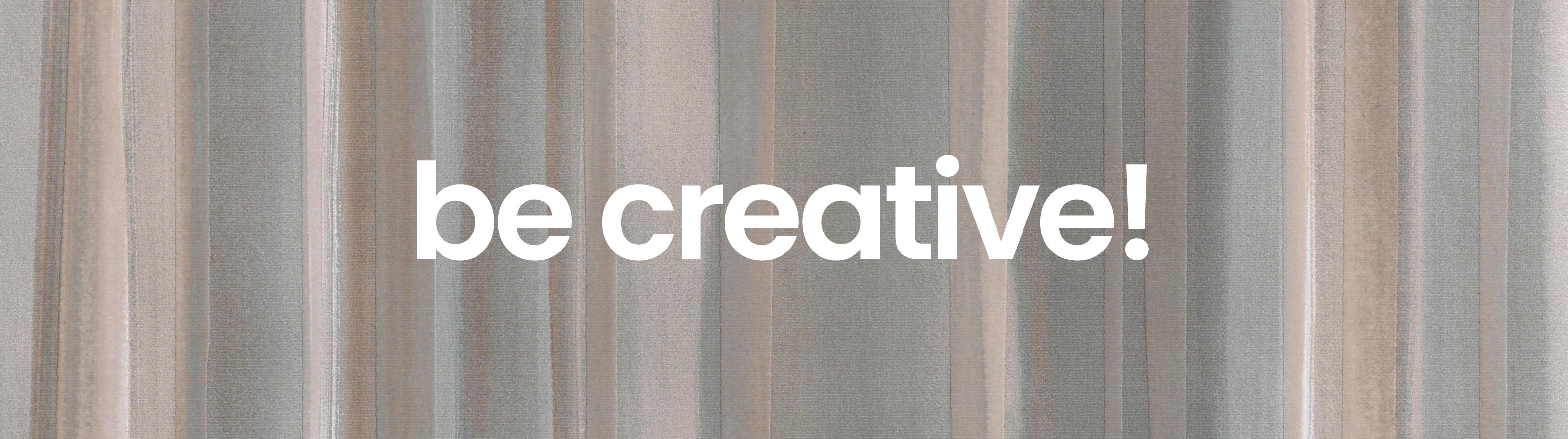 Decorative ceramic surface with tone-on-tone floral pattern and “be creative!” message in central bold font.