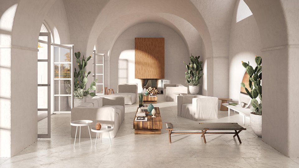 Living room with Mediterranean-style vaults, beige stone-effect flooring and natural furnishings including cacti and light wood.