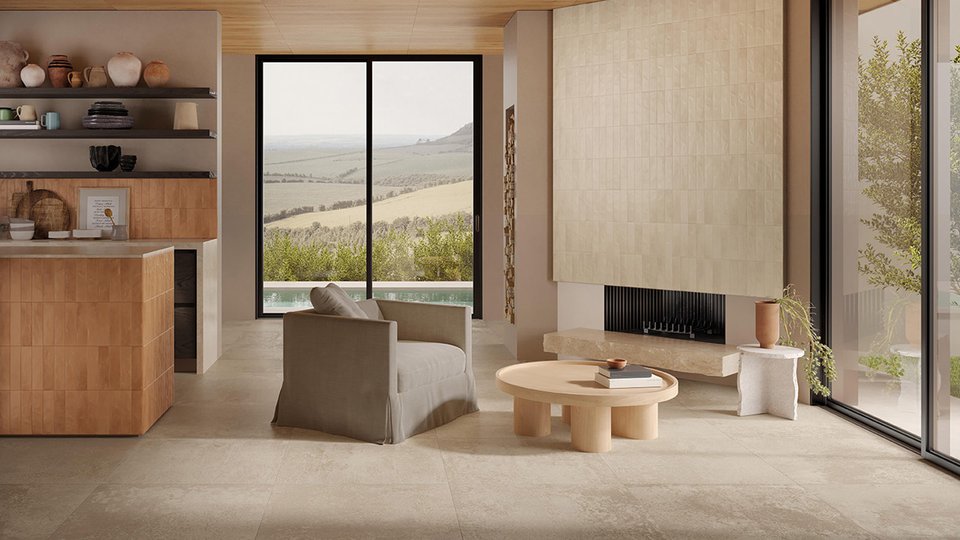 Bright living area with beige stone-effect flooring, light ceramic wall cladding and terracotta-coloured kitchen.